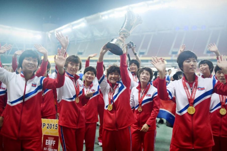 North Korea's women football team celebrate after winning the Women's East Asian Cup with a 2-0 victory over South Korea at the Wuhan Sports Center Stadium on Saturday.