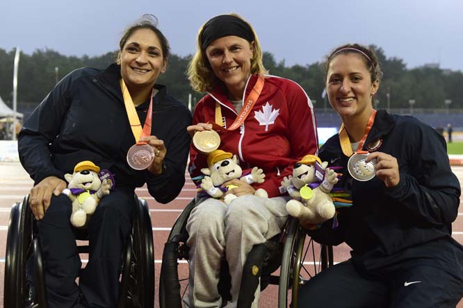 Diane Roy (center) of Canada poses with fellow podium winners Cheri Madsen (left) of the USA and Hannah McFadden also of the USA., following medal presentations for the women's T54 800m event at the 2015 Parapan Am Games in Toronto on Monday. Roy took ho