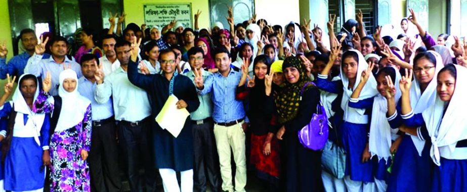 SYLHET: Students and teachers of Lotifa Shafi Chowdhury Mohila Degree College in South Surma Upazial showing V-sign after their successful HSC results on Sunday.