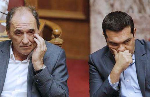 Greek Prime Minister Alexis Tsipras (R) and Economy Minister George Stathakis attend a parliamentary session in Athens, Greece on Friday.
