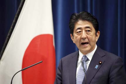 Japanese PM Shinzo Abe delivers a statement at his official residence in Tokyo on Friday.