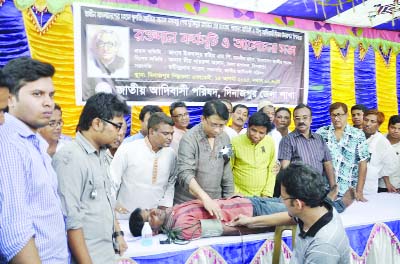 DINAJPUR: National Adibasi Parishad organised a free blood donation programme making the 40th myrterdom anniversary of Fther of the Nation Sheikh Mujibur Rahman and the World Adibashi Day on Friday.