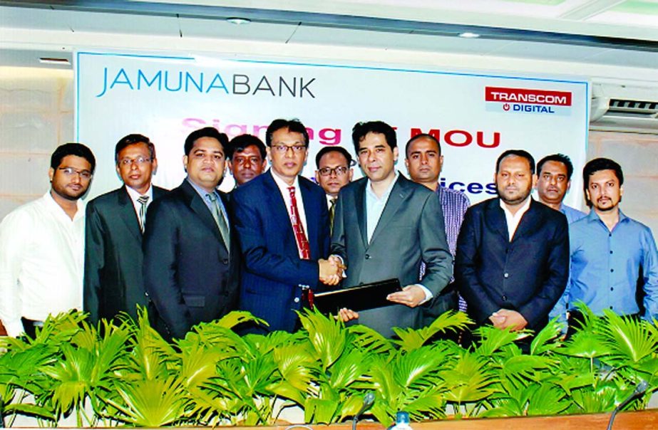 AKM Saifuddin Ahamed of Deputy Managing Director of Jamuna Bank Ltd and Yeamin Sharif Chowdhury, Head of Buisness, Transcom Electronics sign an agreement at the bank's head office on Saturday. Under this agreement all the employees of the bank and JBL cr