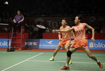 China's Zhao Yunlei (right) and Zhang Nan (left) compete against Indonesia Tontowi Ahmad and Liliyana Natsir during their mixed doubles semifinal match at the Badminton World Federation championships at Istora Stadium in Jakarta, Indonesia on Saturday