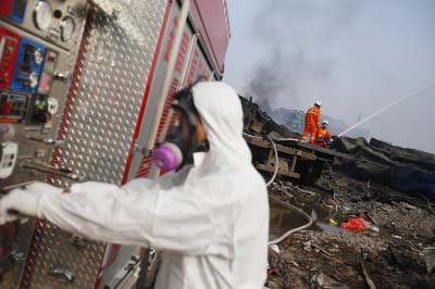 Firefighters work at the site of explosions in Tianjin, north-east China on Saturday.