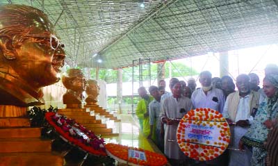 GOURIPUR(Mymensingh): Dr Cap (Retd)Mujibur Rahman Fakir MP, former State Minister for Health and Family Welfare placing wreaths at Bangabandhu Chattar in Gouripur Upazila town marking the National Mourning Day on Saturday. Among others Roushan Ara, for