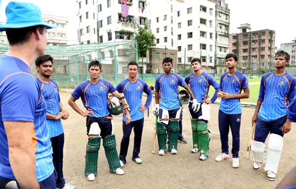Players of BCB High Performance Cricket team listenning to coach during their practice session at Mirpur on Sunday.