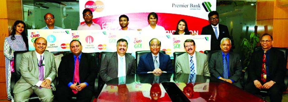 Khondker Fazle Rashid, Managing Director of The Premier Bank Limited, poses with the winners of 'Master- Cards- Go' campaign for its Debit Cardholders' at the bank's head office on Sunday. Other executives were present.