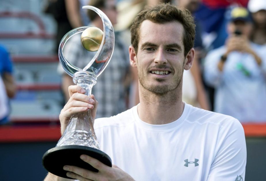 Andy Murray of Britain raises the Rogers Cup winner's trophy following his defeat of opponent Novak Djokovic of Serbia during the men's final at the Rogers Cup tennis tournament in Montreal on Sunday.