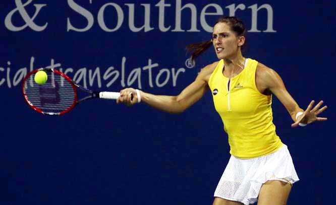 Andrea Petkovic of Germany returns the ball to Julia GÃ¶rges of Germany at the Western & Southern Open tennis tournament in Mason, Ohio on Monday.