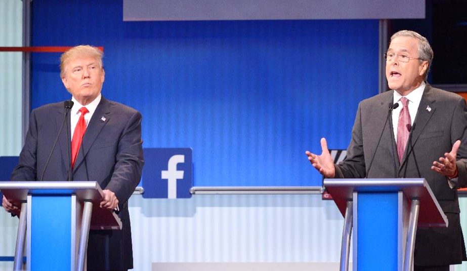 Real estate tycoon Donald Trump (L) and former Florida governor Jeb Bush (R) participate in the Republican presidential primary debate at the Quicken Loans Arena in Cleveland, Ohio.