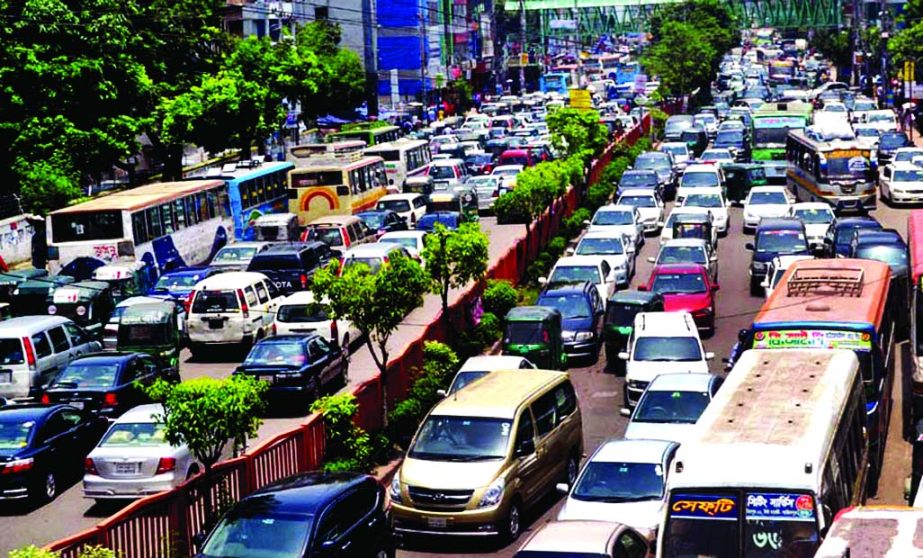 City experienced huge traffic gridlock causing immense sufferings to commuters as vehicles remained stuck up. This photo was taken from Bangla Motor area on Wednesday.