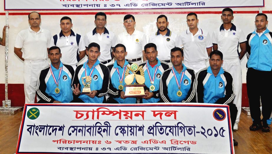 Members of Comilla Area team, the champions of the Bangladesh Army Squash Competition with Military Secretary Major General Anwarul Momen pose for a photograph at the Air Defense Sports Complex in Mirpur Cantonment on Thursday.