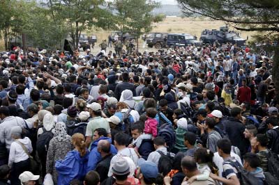 Thousands of people, most of them Syrian refugees, are heading north towards the EU border from the Greece-Macedonia frontier.
