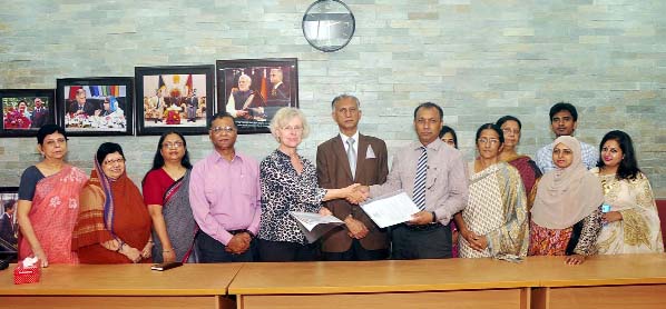 Treasurer of Dhaka University Prof Dr Md. Kamal Uddin and President of Trauma-AidHap-Switzerland Hanna Egli-Bernd sign a MoU at DU VC Office on Monday. Prof Dr AAMS Arefin Siddique, Vice-Chancellor of the University was present on the occasion.