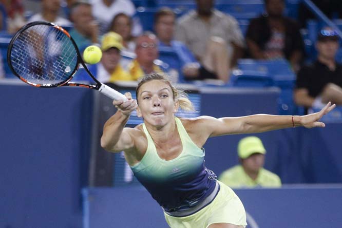 Simona Halep of Romania returns the ball to Jelena Jankovic of Serbia during a semifinal match at the Western & Southern Open tennis tournament in Mason, Ohio on Saturday. Halep defeated Jankovic 6-1, 6-2.