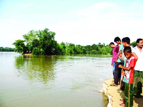 NAOGAON: Some four villages were submersed as Atrai River's protection dam has been collapsed. This picture was taken on Saturday.