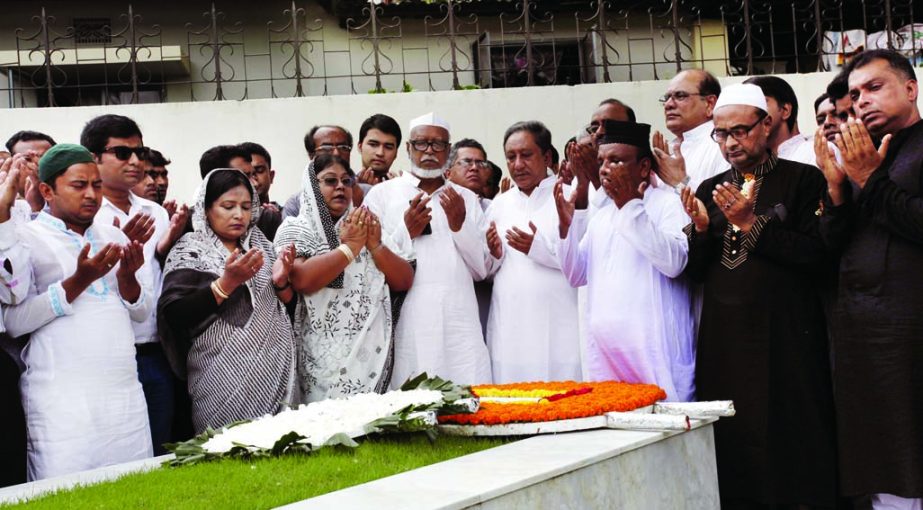 Family members and Awami League leaders and activists offering munajat after placing floral wreaths at the grave of AL leader Begum Ivy Rahman in the city's Banani Graveyard on Monday marking her 11th death anniversary.