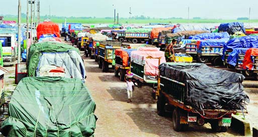 Hundreds of vehicles along with heavy goods laden trucks stranded on Shimulia- Kawrakandi Highway for about 2/3 days as ferry services on the Padma River being halted due to crisis of navigability. This photo was taken from Mawa Ghat on Monday.