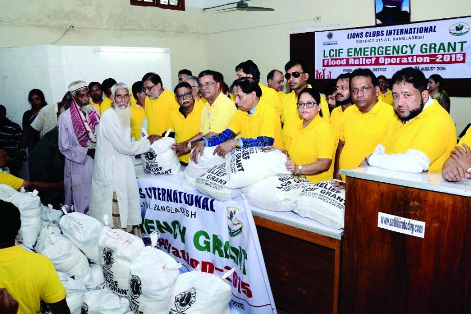 BARGUNA: Members of Lions Club International distributing relief goods among flood affected people in Barguna recently.