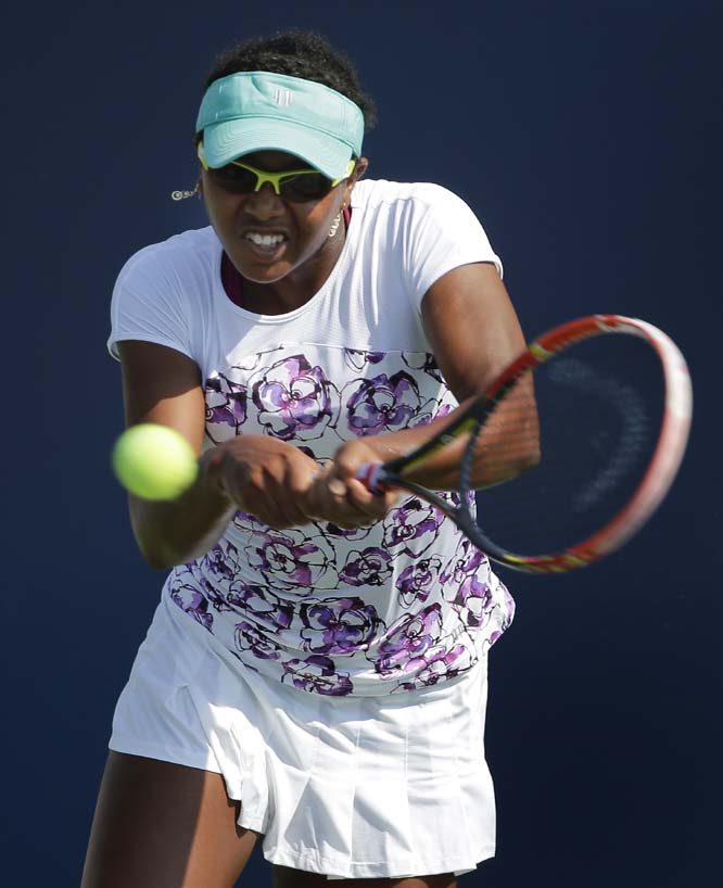 Vicky Duval of the United States hits a backhand shot to Luksika Kumkhum of Thailand during the first set of a US Open qualifying tennis match on Tuesday in New York. The qualifying round is Duval's second tournament this year after missing last season t