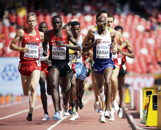 Britain's Mo Farah (right) competes in a menâ€™s 5000m round one heat at the World Athletics Championships at the Bird's Nest Stadium in Beijing on Wednesday.