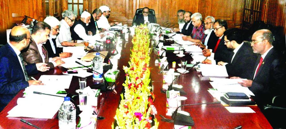 Mohiuddin Ahmed, Chairman of Shahjalal Islami Bank Securities Limited, presiding over the 32nd meeting at the bank's head office recently.