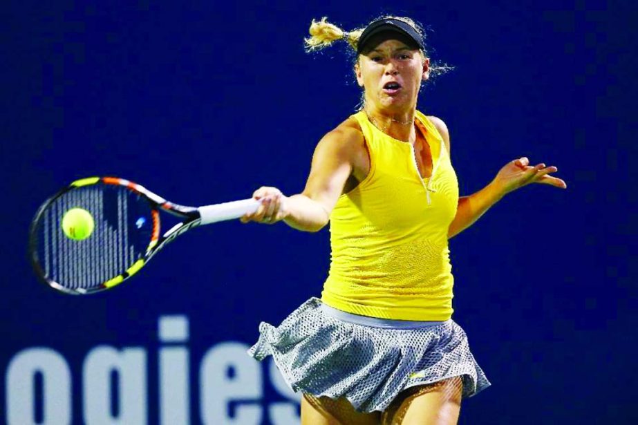 Caroline Wozniaki returns a forehand to Caroline Garcia on Day 4 of the Connecticut Open in New Haven, Connecticut on Thursday.