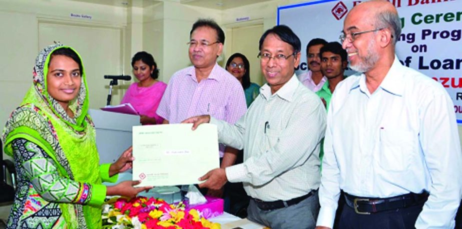 Monjur Hossain, Chairman of Rupali Bank, distributing certificates among the probationary officers of the bank at its Training Academy auditorium recently. Principal of the academy Md Nazrul Islam and Training Specialist Korban Ali were present.