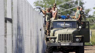 Hungary is hoping to finish erecting a 175km razor-wire fence in the next few days