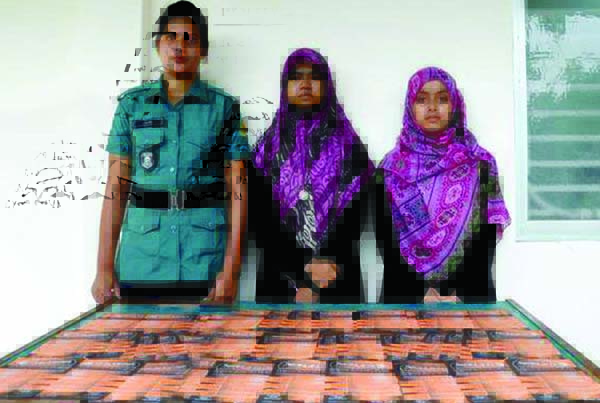 Law enforcers nabbed two female members of banned organisation Hizbut Tahrir from in front of RAJUK College in the city's Uttara on Tuesday.