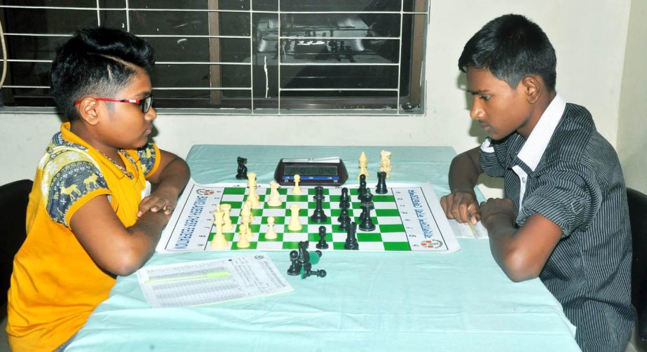 FM Fahad Rahman of Pirojpur (left) and Subrata Biswas of Mymensingh (right) in action during the 5th round games of the 34th National Sub-Junior (Under-16) Chess Championship at the Bangladesh Chess Federation hall-room on Wednesday.