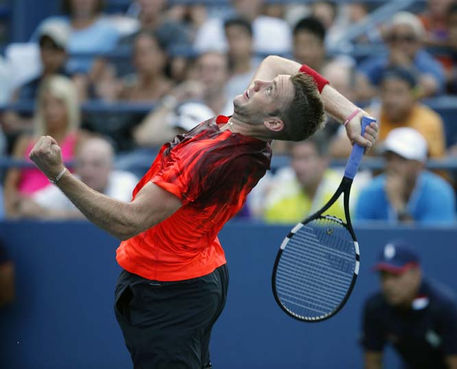 Jack Sock of the United States rears to serve during his first round match against Victor Estrella Burgos of the Dominican Republic in the US Open Tennis tournament in New York on Tuesday.