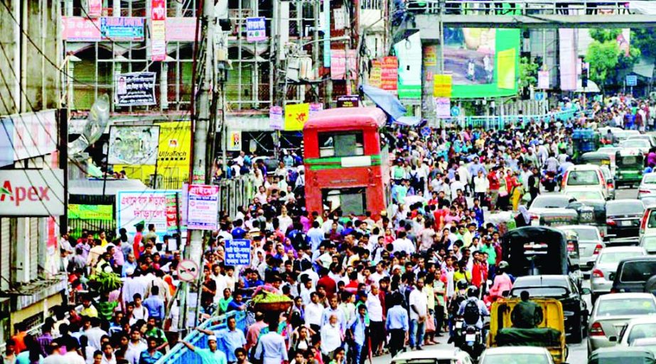 Hundreds of people were found stranded on different city roads as many buses remained off the road due to waterlogging. This photo was taken from Farmgate on Wednesday.