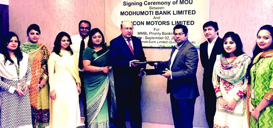 Javed Khan, head of corporate and investment banking of Modhumoti Bank Limited and Shoeb Ahmed, Chief Operating Officer of Rancon Motors Limited, exchanging agreed documents for discounts on Mercedes-Benz for priority clients at the bank's Gulshan branch