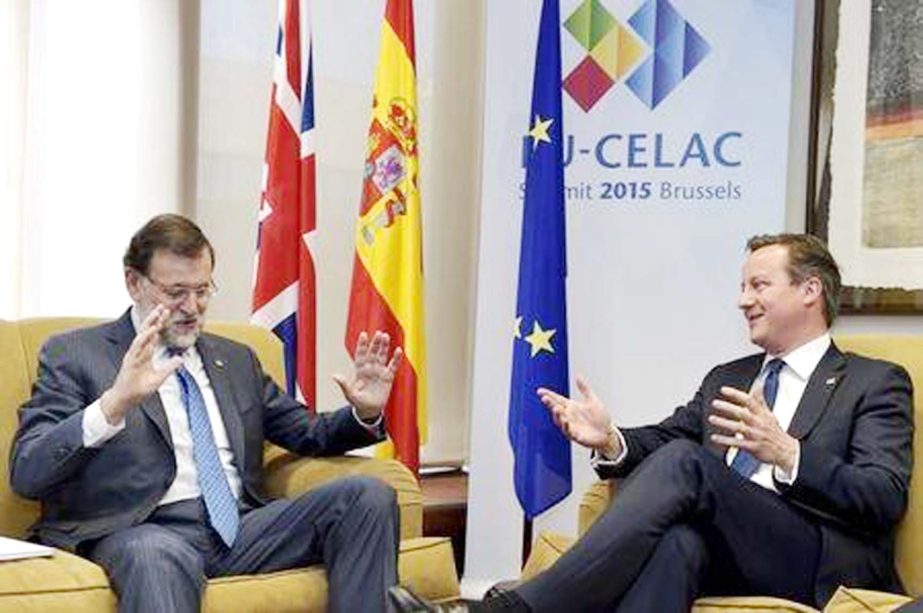 Britain's Prime Minister David Cameron (R) holds a bilateral meeting with Spain's Prime Minister Mariano Rajoy at the European Council in Brussels, Belgium .