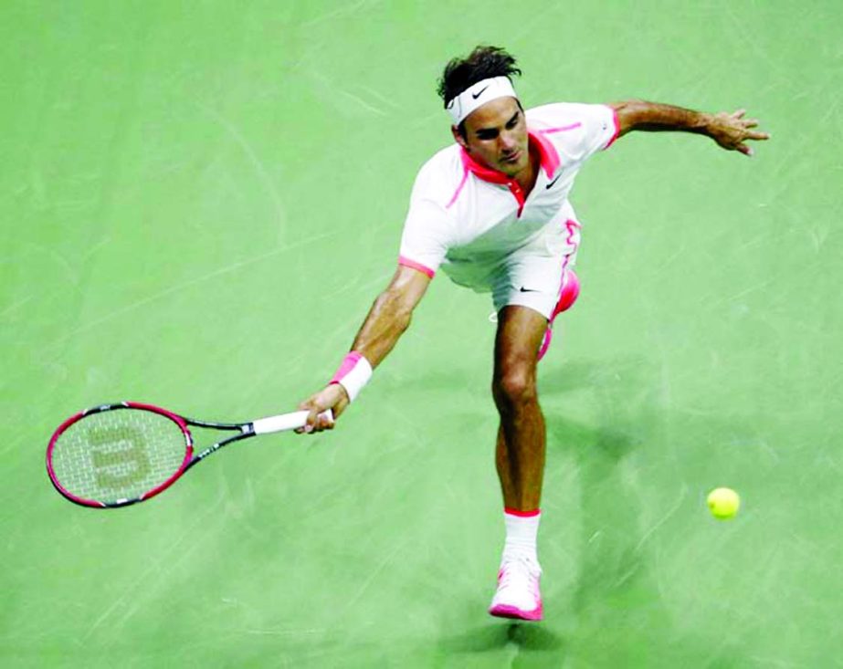 Roger Federer of Switzerland chases down a shot from Steve Darcis of Belgium during the second round of the US Open tennis tournament in New York on Thursday.