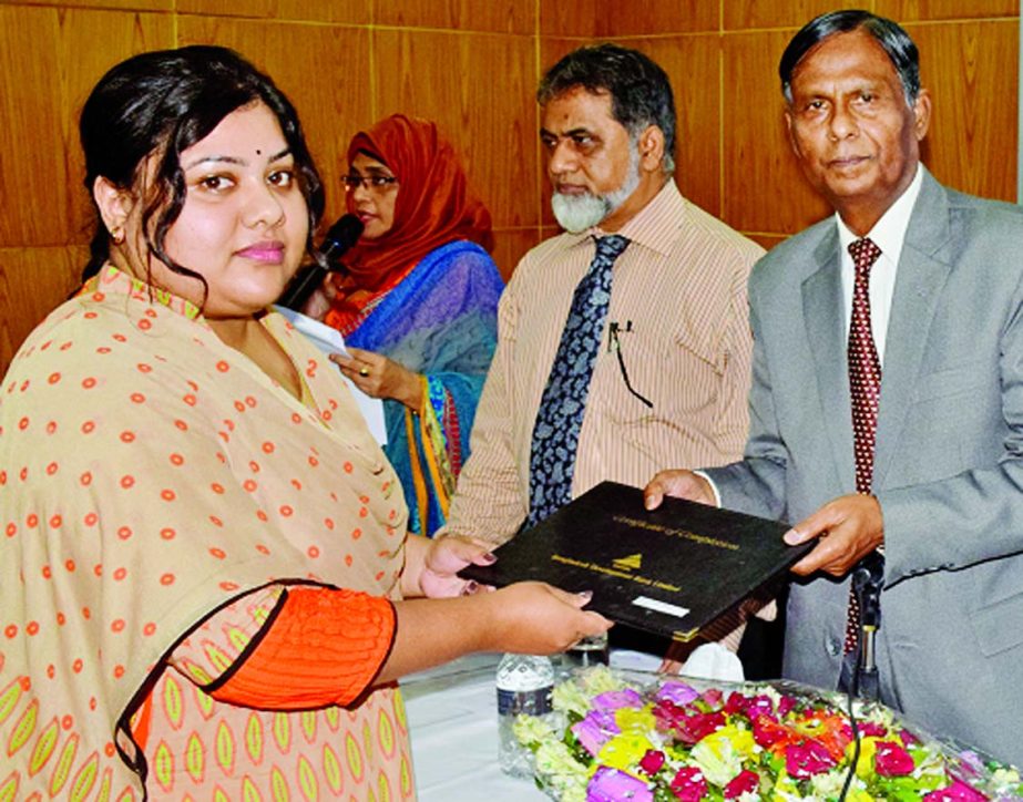 Md Yeasin Ali, Chairman of the board of Directors of BDBL, handing over certificates among participants of a month long foundation training course for newly recruited officers at bank's Karwan Bazar training institute recently.