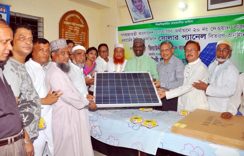 Ziauddin Ahmed Bablu MP and CCC Acting Mayor Chowdhury Mahmud Hasan distributing solar panel to different mosques in the city yesterday.