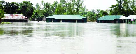 JAMALPUR: Hundreds of houses and schools in Jamalpur are being inundated as flood situation aggravated in Jamalpur. This picture was taken on Sunday.