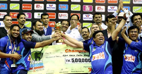 Players of American International University of Bangladesh (AIUB) celebrate with the trophy of the Clemon Indoor Uni Cricket Tournament beating Bangladesh University in the final at the Shaheed Suhrawardy National Indoor Stadium in Mirpur on Monday.