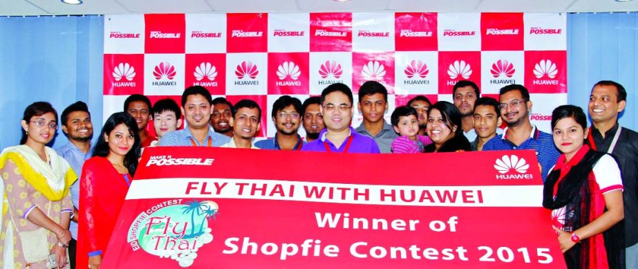 Ingmar Wang, Director of Device Business of Huawei Technologies (Bangladesh) Ltd poses with the Huawei "Fly Thai Selfie Contest" winners at a program in the city recently.