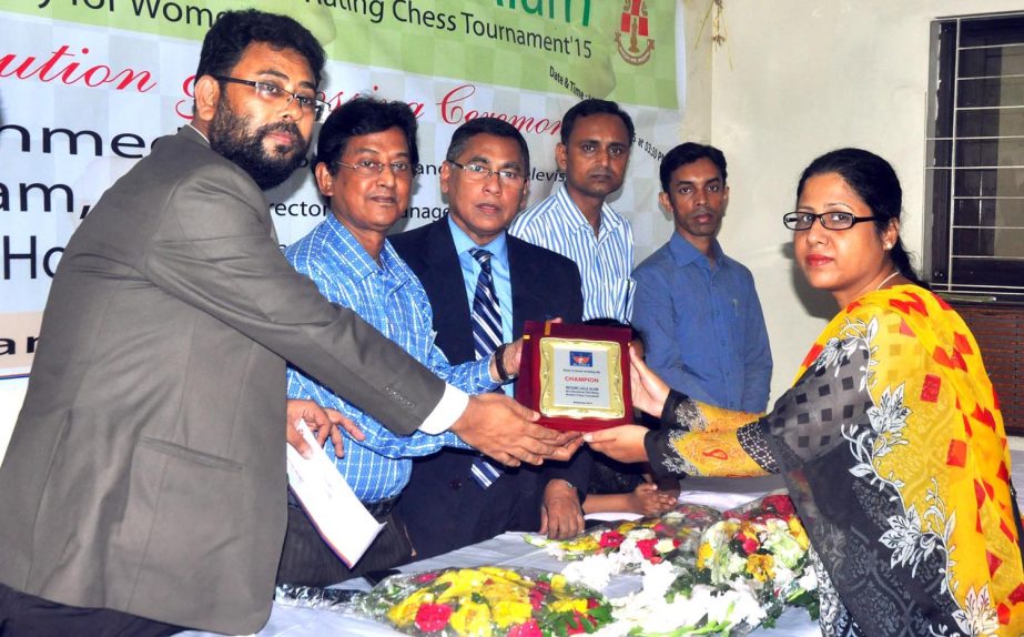 WFM Nazrana Khan Eva of Bangladesh Navy receiving the champion award of the 8th Begum Laila Alam International Rating Women Chess Tournament at the Bangladesh Chess Federation hall-room on Thursday.