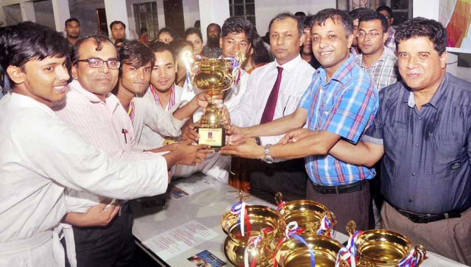 Treasurer of Dhaka University Professor Dr Md Kamal Uddin distributes the prizes of the Inter-Hall Judo and Karate Competition among the winners as the chief guest at the Gymnasium of the Physical Education Centre of Dhaka University on Thursday.