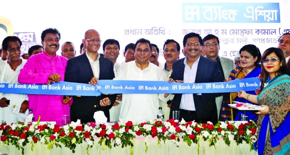 Planning minister AHM Mustafa Kamal, FCA, MP, inaugurating the 101st branch of Bank Asia Ltd at Nangalkot Upazila in Comilla on Sunday. Md Samsuddin Kalu, Chairman, Nangalkot Upozila, . Rumee A Hossain, Chairman of executive committee and Md Mehmood Husai