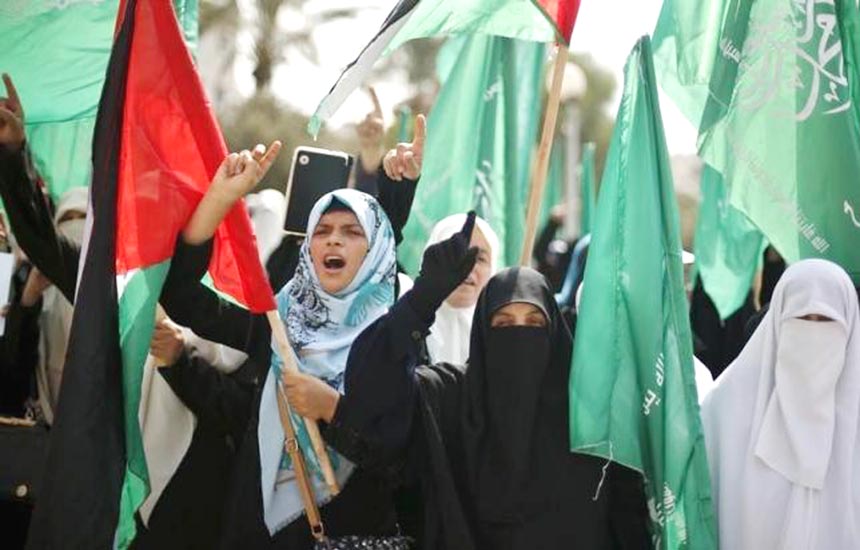 Palestinian women supporting Hamas take part in a rally to protest against an Israeli police raid on Jerusalem's Al-Aqsa Mosque, in Gaza City on Tuesday.