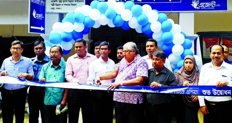 AHM Abdullah, Managing Director of Small Farmers Development Foundation (SFDF) and Md Arfan Ali, Deputy Managing Director of Bank Asia Limited, inaugurating an agent banking outlet of Bank Asia Ltd at SFDF office, Bera Upazila in Pabna on recently. Anothe