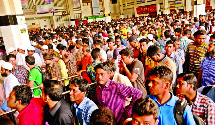 Train ticket aspirants in a long queue to collect advance tickets in Kamalapur Railway Station on Tuesday.