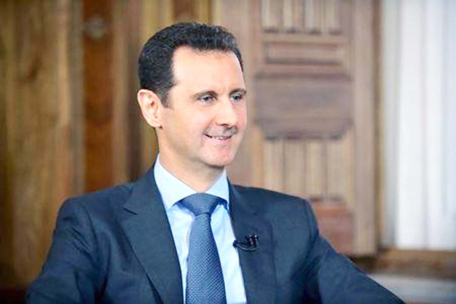 Syria's President Bashar al-Assad answers questions during an interview with al-Manar's journalist Amro Nassef, in Damascus, Syria.