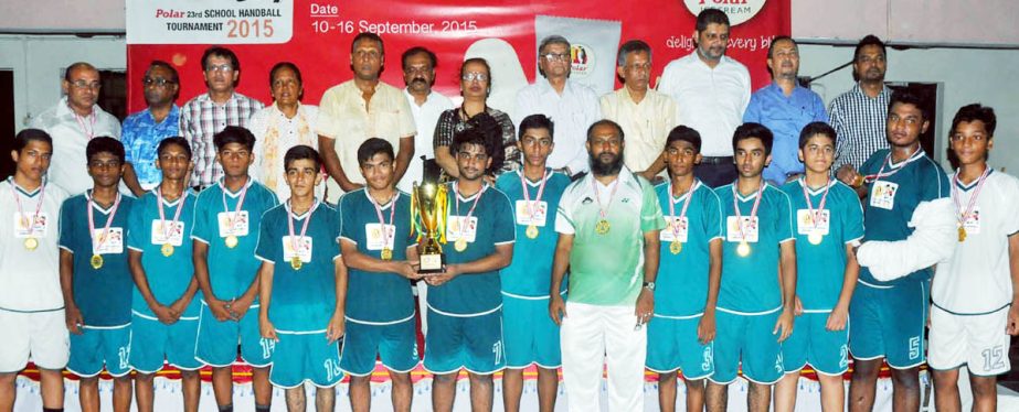 Members of Saint Gregory's High School, the champions of the Boys' Group of the Polar Icecream 23rd School Handball Tournament with the guests and officials of Bangladesh Handball Federation pose for a photo session at the Shaheed (Captain) M Mansur Ali